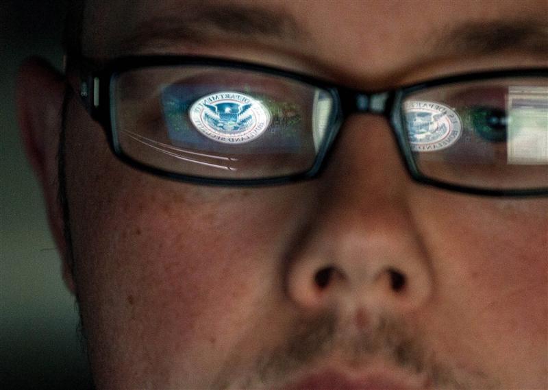 A cyber security analyst works in a watch and warning center at a Department of Homeland Security cyber security defense lab at the Idaho National Laboratory