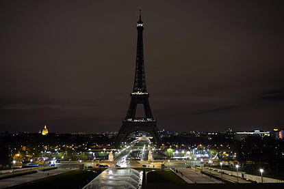 A picture taken on November 14, 2015 shows the Eiffel Tower with its lights turned off following the deadly attacks in Paris. Islamic State jihadists claimed a series of coordinated attacks by gunmen and suicide bombers in Paris that killed at least 129 people in scenes of carnage at a concert hall, restaurants and the national stadium. AFP PHOTO / ALAIN JOCARDALAIN JOCARD/AFP/Getty Images